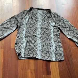 Animal print , three quarter length sleeve blouse.